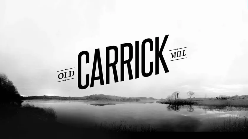 Old Carrick Mill black wordmark over a monochrome lake landscape
