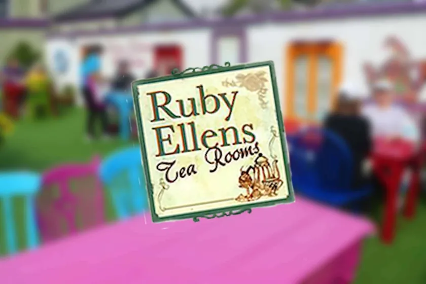 Ruby Ellens Tea Rooms illustrated sign in a colourful garden