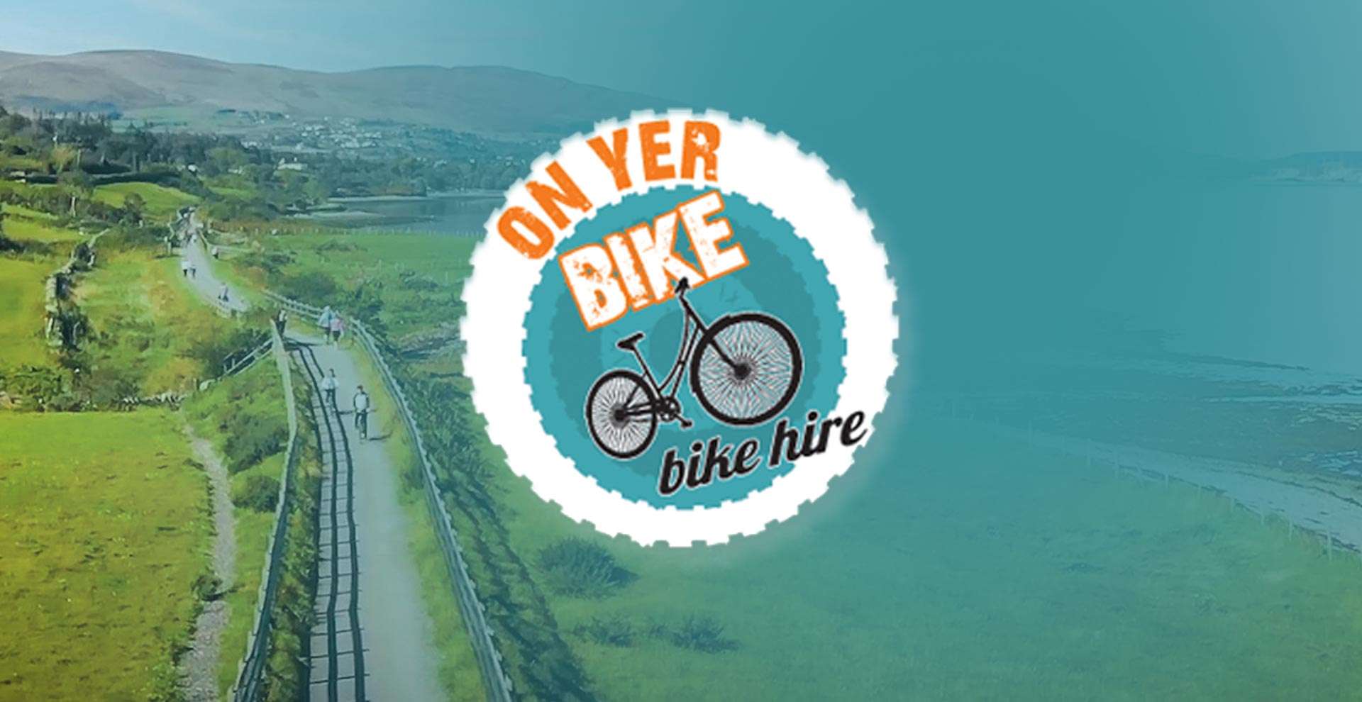 On Yer Bike hire logo over the Carlingford countryside and cycling path