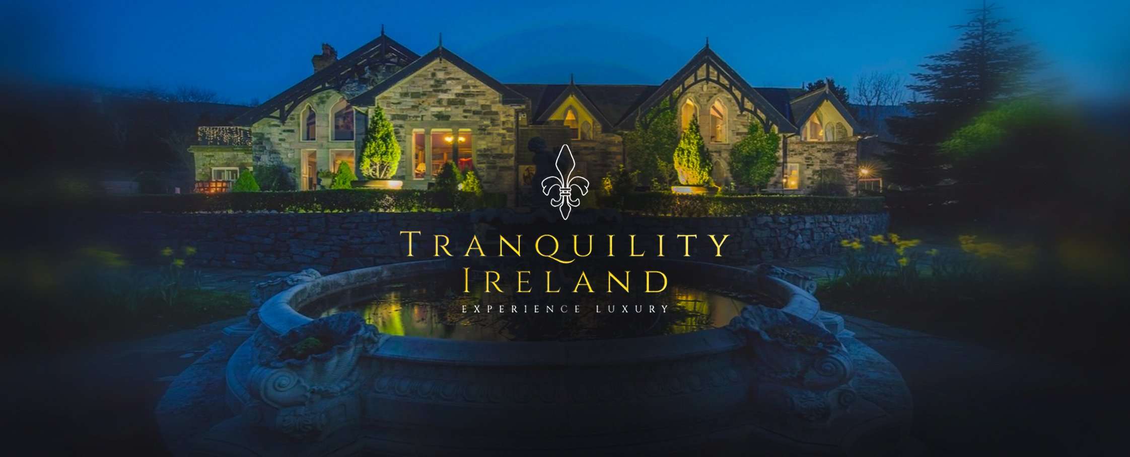 Tranquility Ireland logo over an illuminated stone house and fountain