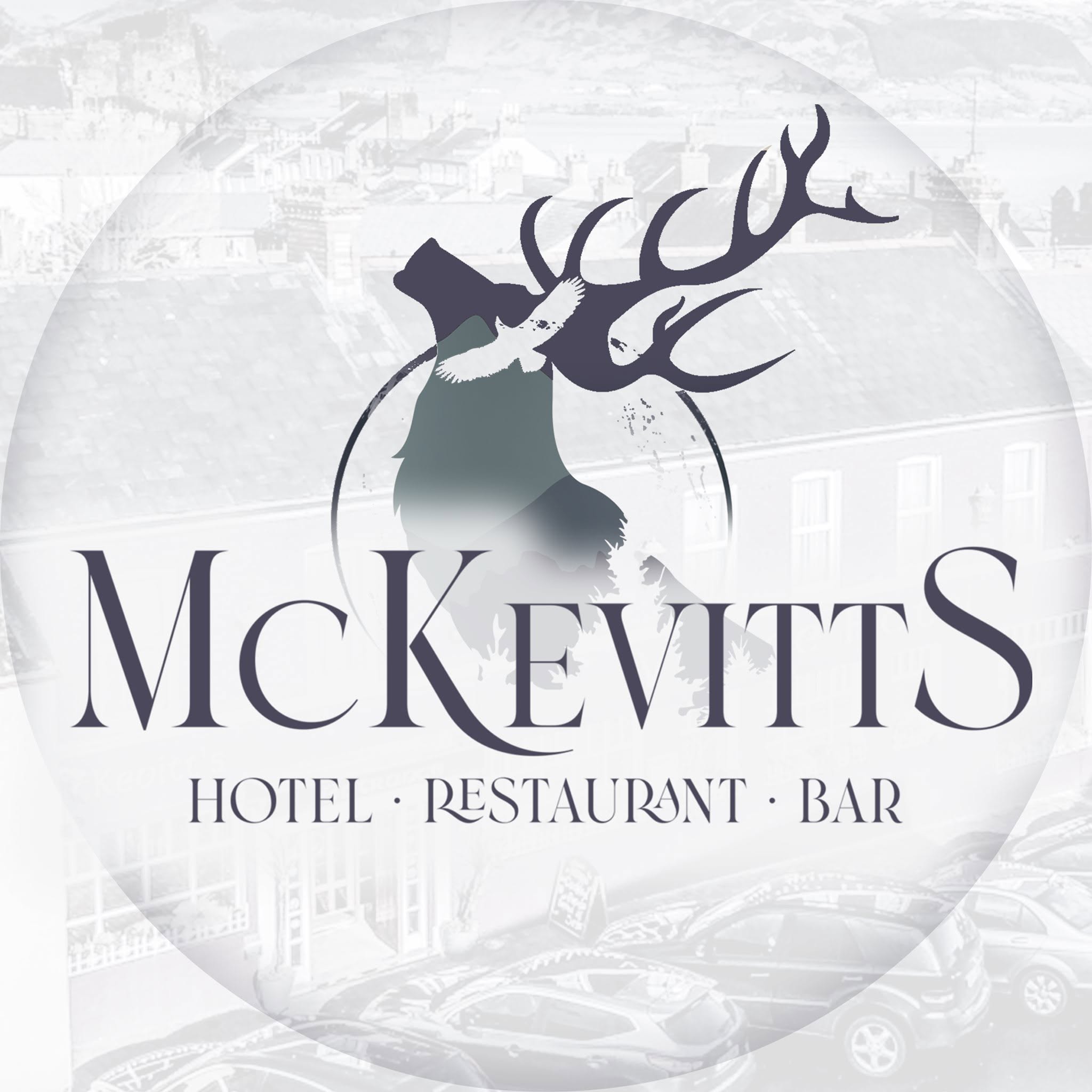 McKevitt’s stag and mountain identity with the hotel building behind it